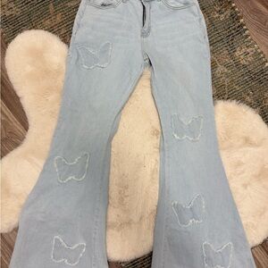Women's Light Blue Flared Jeans with Butterfly Accents
